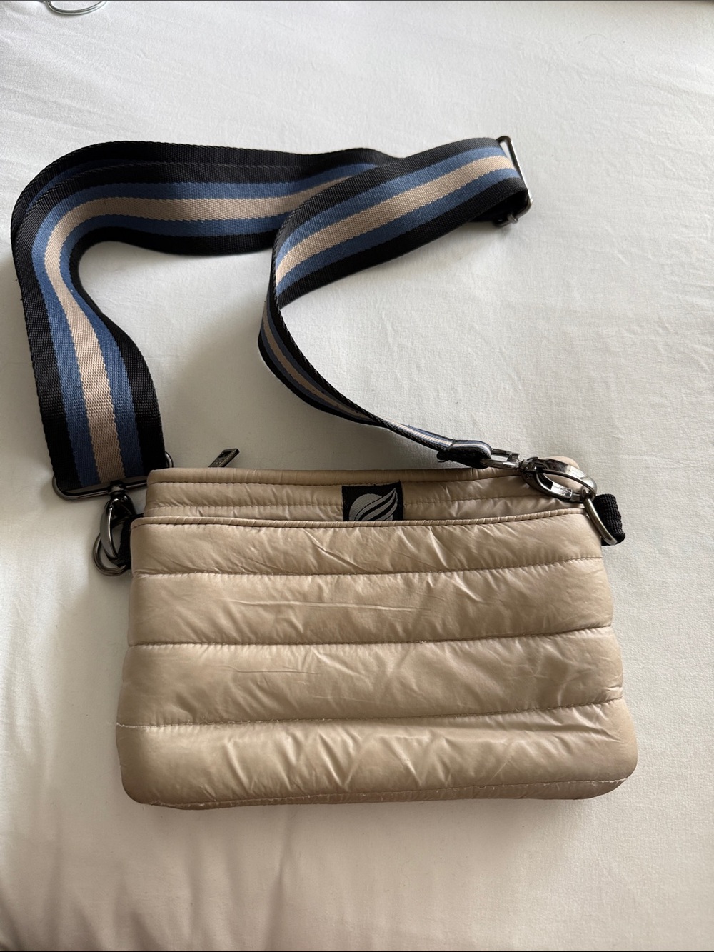 THINK ROYLN Beige Quilted Shoulder Bag with Striped Blue-Black Strap